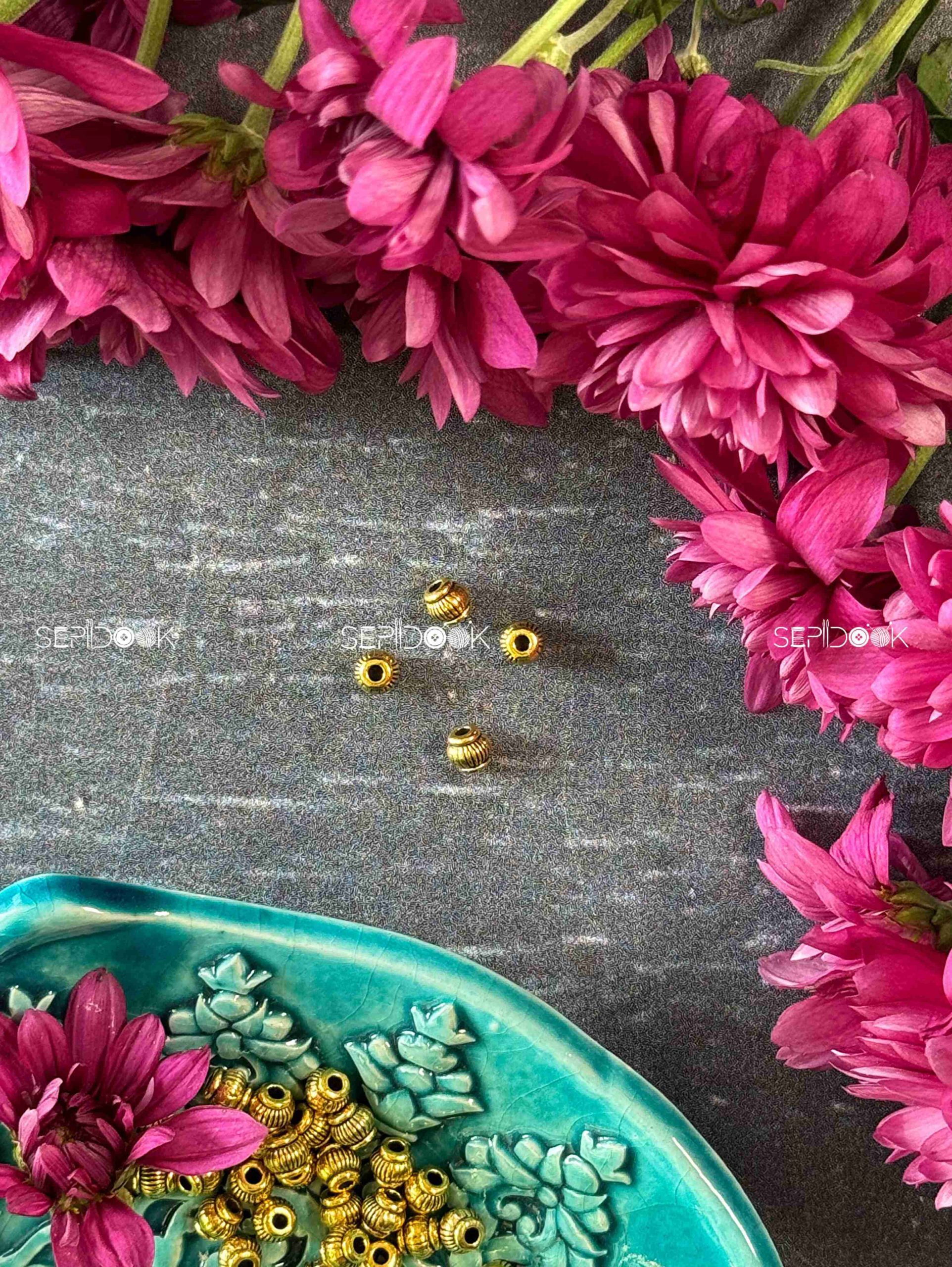 مهره طلایی تراش دار
