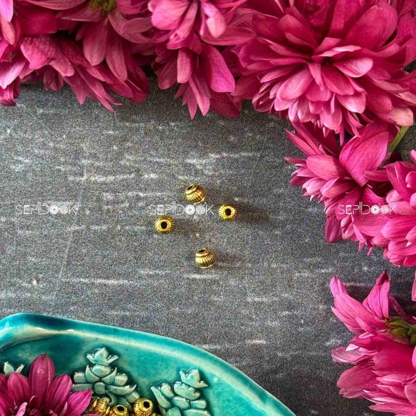 مهره طلایی تراش دار
